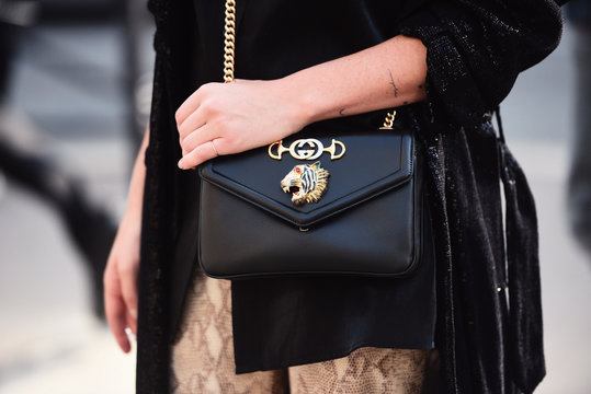 September 28, 2018: Paris, France - Girl wearing a stylish Gucci hand bag after a fashion show during Paris Fashion Week  - PFWSS19
