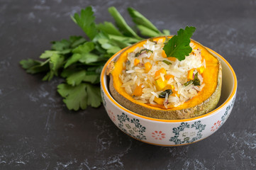 Baked pumpkin stuffed with rice and vegetables
