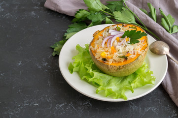 Baked pumpkin stuffed with rice and vegetables