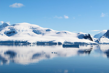Obraz na płótnie Canvas Mountains and icebergs between the islands around the Antarctic Peninsula, Palmer Archipelago, Antarctica