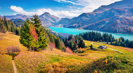 Marvelous morning view of Roselend lake/Lac de Roselend. Colorful autumn scene of Auvergne-Rhone-Alpes, France, Europe. Beauty of nature concept background.