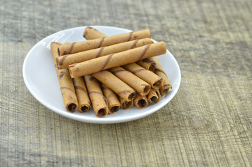 Chocolate waffle roll in white plate