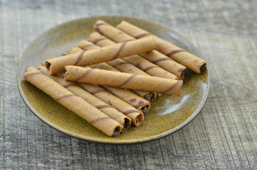 Chocolate waffle roll in brown plate