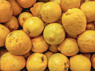 Fresh organic lemons on a market shelf