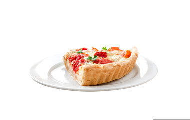 Tart with salted sheep cheese and tomatoes on a plate isolated on white background with clipping path