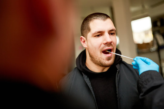 Man giving a saliva sample for DNA test