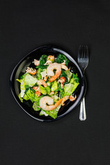 Caesar salad with shrimps, top view