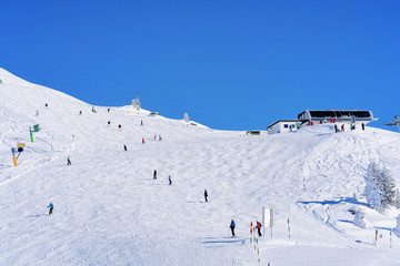 Skiers skiing at Zillertal Arena ski resort in Austria