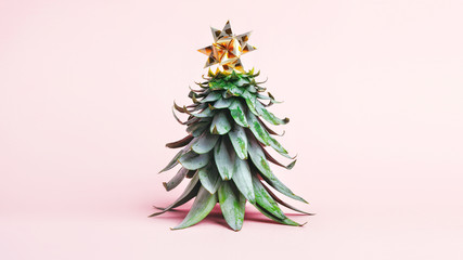 Pineapple leaves in the form of a Christmas tree with decorations. Creative christmas concept. 2020 year