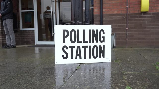 People turning up at a polling station on an election day