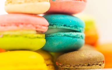 Colorful macaron cookies on white background, select and soft focus