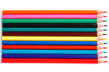 Rods of colored pencils in a row as a background in the entire screen.