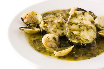 Hake fish and clams with green sauce. Typical spanish recipe. Close up	