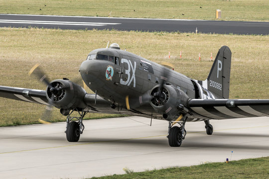 EINDHOVEN, THE NETHERLANDS - SEP 17, 2016: World War II Dakota C-47 cargo plane in US Air Force colours taxiing after landing on Eindhoven airbase.