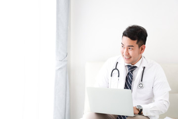 portait of Asian doctor in hospital white background