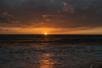 Naklejka na ściany i meble Beautiful sunset on the shore of the Indian Ocean