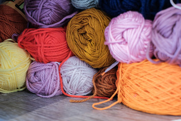Full Frame Shot Of Multi Colored Woolen Balls On Shelf At Shop