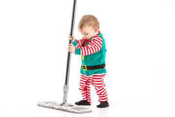 Studio photo with white background of a baby disguised as a elf