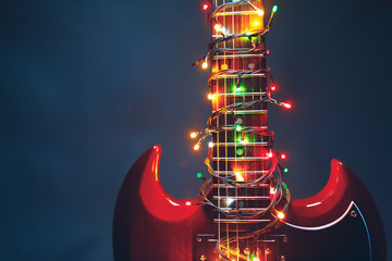 electric guitar with festive Christmas lights