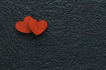 Wooden hearts on a black background. Valentines Day concept.