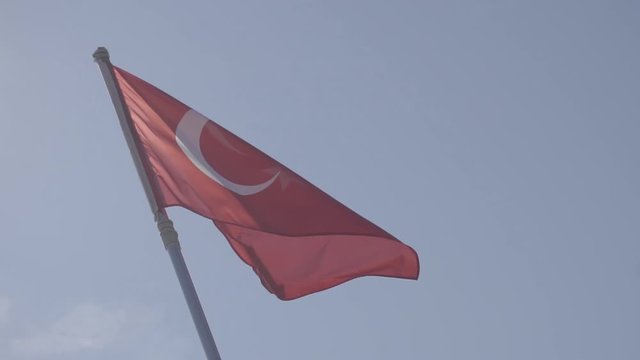 Red Turkish Symbol Flag On Wind.Turkish Flag On Side Of Boat.Banner On Boat Ship In The Wind In Istanbul .Vivid Red Turkish Flag Flutter On Wind Against, Stern Of Ferry Boat.
