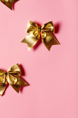 Pink celebration background with golden bow