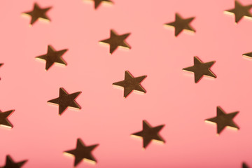 Pinky holiday background with golden stars