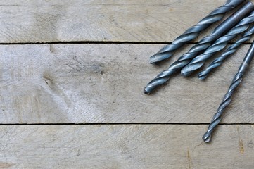 black drill on wooden background