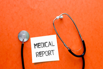 Medical Report on white sticky note with stethoscope