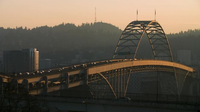 Sunset shot of traffic entering and leaving Portland, Oregon on the Interstate bridge.