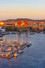 Sunset aeriel view at harbour of Oslo with boats and the famous city hall, Norway