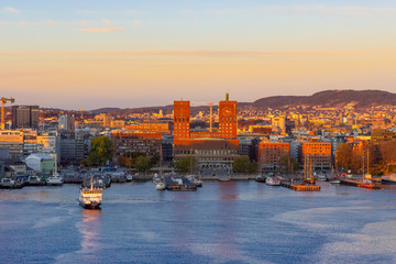 Sunset aeriel view at harbour of Oslo with boats and the famous city hall, Norway
