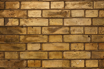 Yellow plain big brick wall surface backdrop