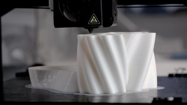 The 3D printer prints the model out of white plastic. Modern techology. 4K HD. with sound