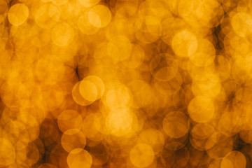 Blurred gold confetti background.