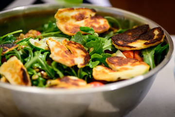 Traditional brazilian salad of queijo coalho rennet cheese curds and arugula