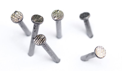 Metal nail head on a white background