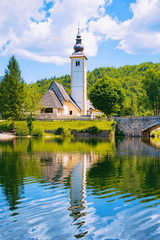 Fototapeta na wymiar Scenery with Church St John Baptist Bohinj Lake in Slovenia