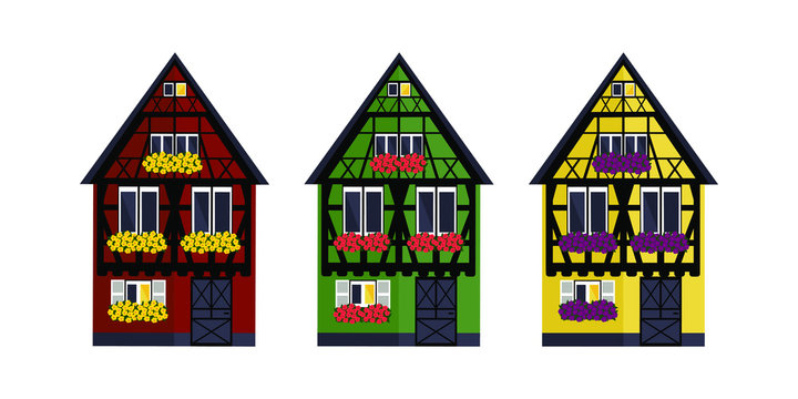 Three houses of different colors in Alsaces style. Green, red and yellow houses in Alsaces style.