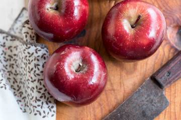 Apples very red and bright, appetizing, on a table