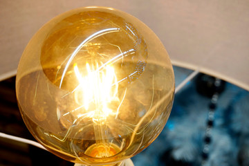 Yellow incandescent lamp in a modern style