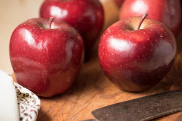 Apples very red and bright, appetizing, on a table