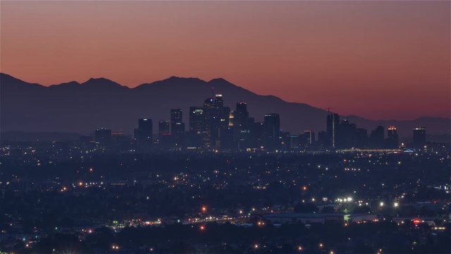 4K Timelapse Sequence of Los Angeles, USA - Mid-shot of the city s skyline from night to day