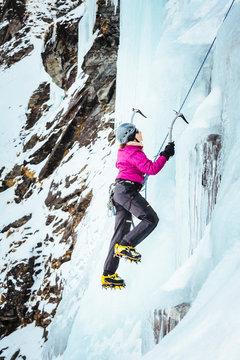 New Zealand, Otago, Wye Creek basin. A woman is ice climbing on the first pitch of 'The Iron Curtain'.