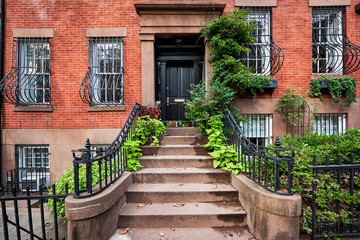 Steps leading up to a historic brownstone building in an iconic neighborhood of Manhattan, New York City.