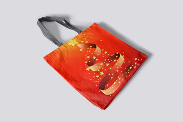Red bag for Christmas gifts, with a stylized fir tree, and a star on the top.