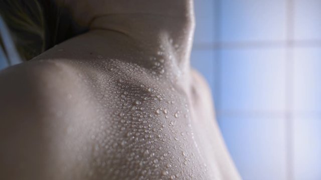 Droplets on wet skin of neck collarbone breast and shoulder