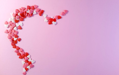 Valentine's Day. Frame made of gifts, candles, confetti on pink background. Valentines day background. Flat lay, top view, copy space.	