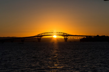 Auckland Harbour Bridge at sunset.