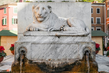 Marble lion on the monument to Maria Beatrice d'Este in Alberica square